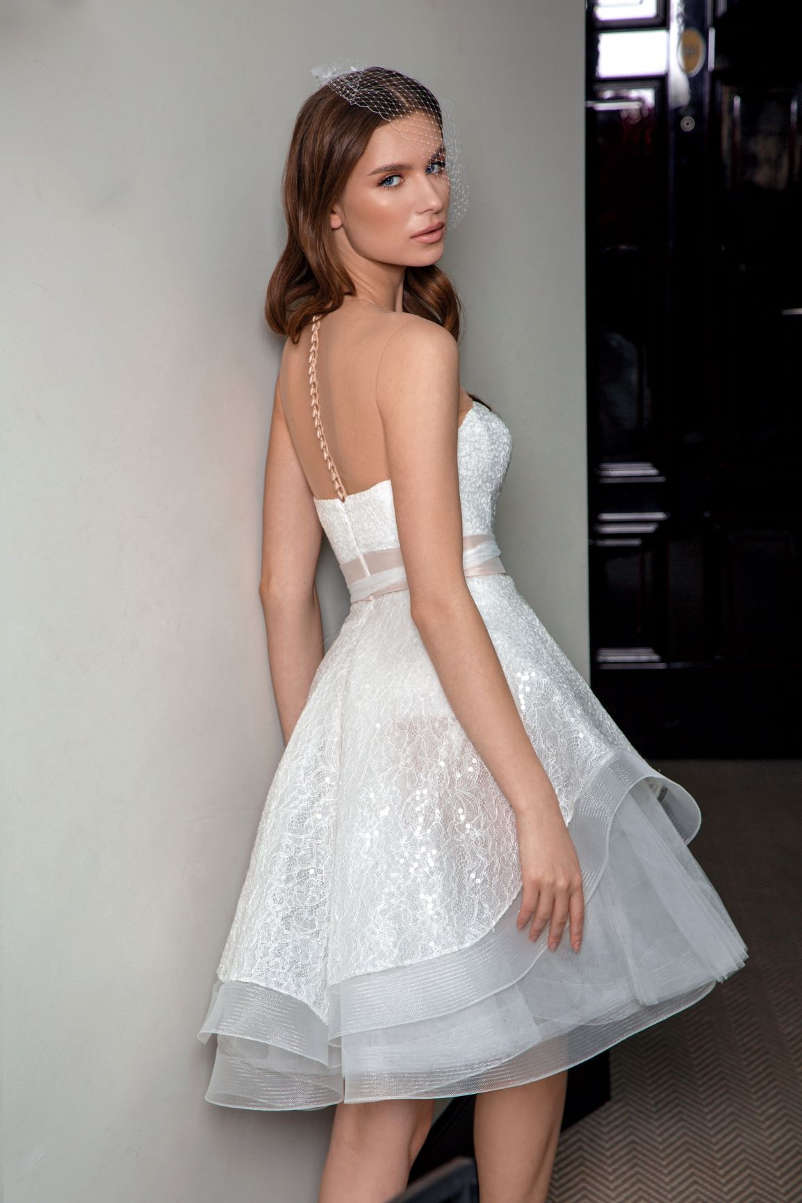 Side view of the ivory colour corset dress Floriana