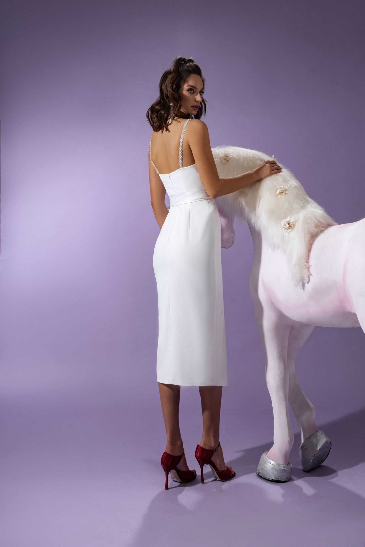 Rear view of the ivory colour satin midi dress Spike